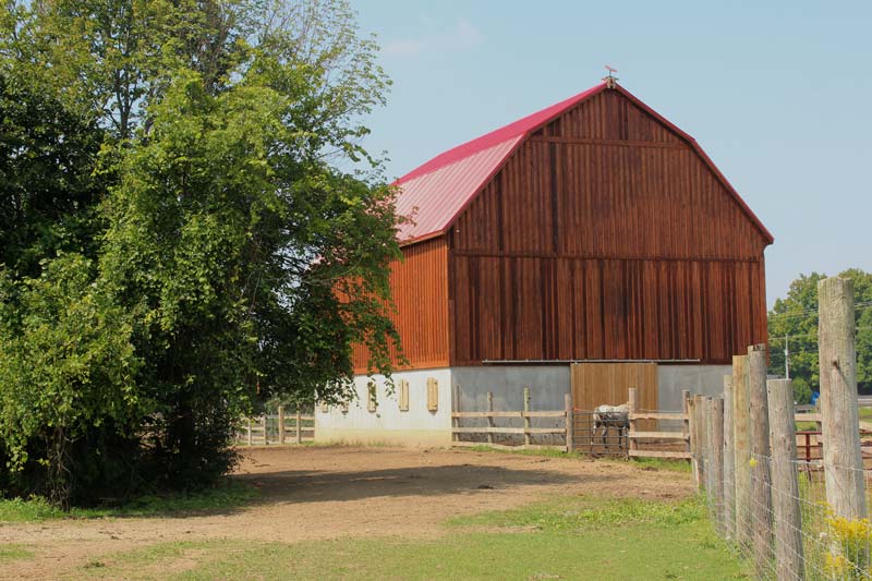 a red barn event space on a beautiful summer day